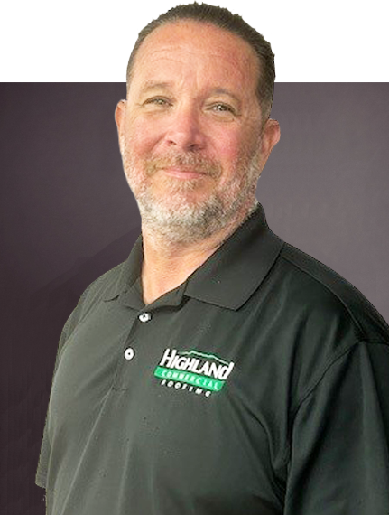 A man with short hair and a beard is wearing a black polo shirt with a Highland Commercial Roofing logo. He is standing against a gradient dark background.